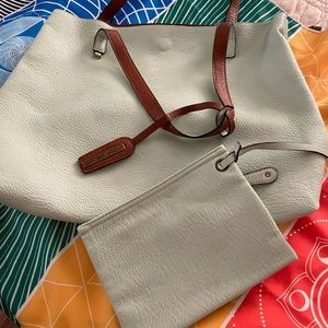 Street Level reversible faux leather tote and Wristlet. Never used